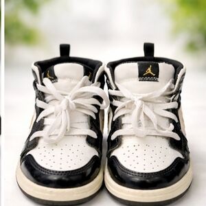 Jordan Kids Black, White & Gold High-Top Sneakers.